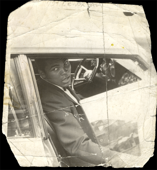 Muhammad Ali in the car, New York City, 116th Street and Lenox Ave.