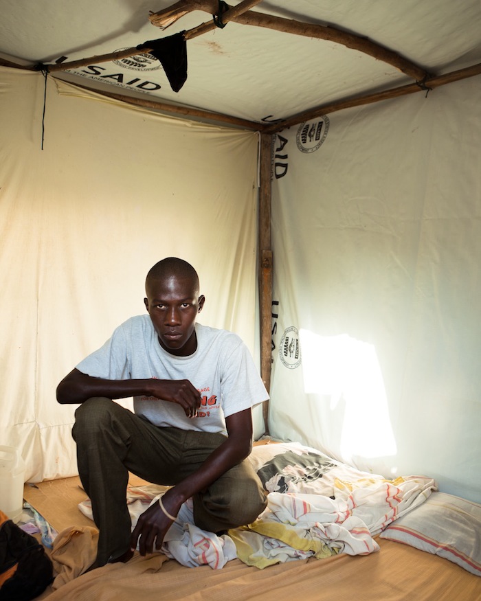Man in U.S.A.I.D. Tarp Shack, Delmas 31