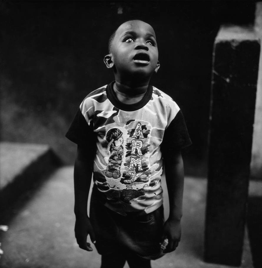Untitled, 1999-2003 (young boy with army shirt), © Tim Hetherington, Courtesy Yossi Milo Gallery, New York