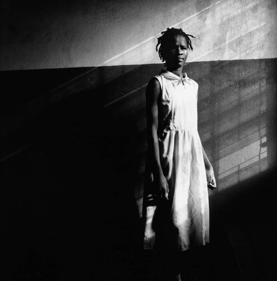 Untitled, 1999-2003 (young girl at wall), © Tim Hetherington, Courtesy Yossi Milo Gallery, New York