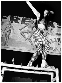 Here she is walking on a platform of large machetes.