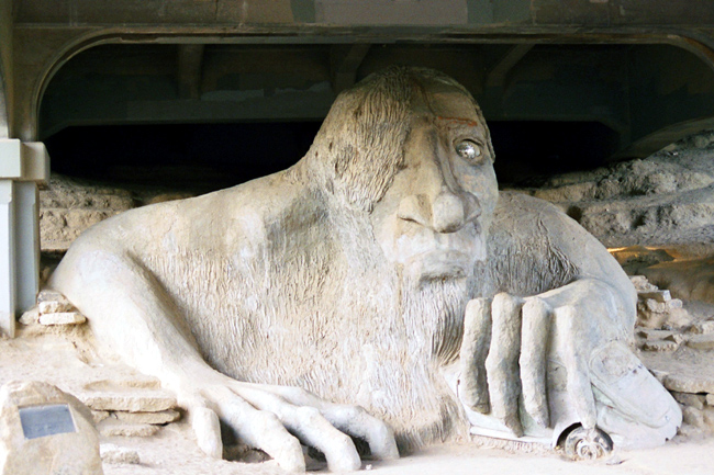 <b>Fremont Troll</b><br />The Fremont Troll lives under the Aurora Bridge and—to give you a sense of scale, here—clutches an actual VW bug in his left mitt. He’s part of the triumvirate of Screwy Fremont Art, along with the aforementioned “Waiting for the Interurban” sculpture and the 16-foot bronze statue of Lenin (yes, <i>that </i>Lenin) residing five blocks away.<br /><br />Mileage: 3.1 of 6.0